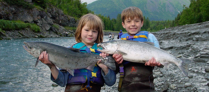 Kids enjoy fishing for silver salmon in Bird Creek, Alaska
