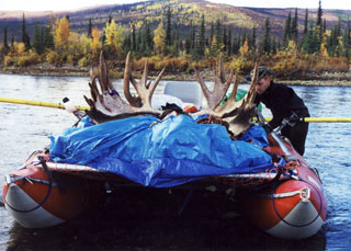 Cataraft with a load of moose meat and antlers