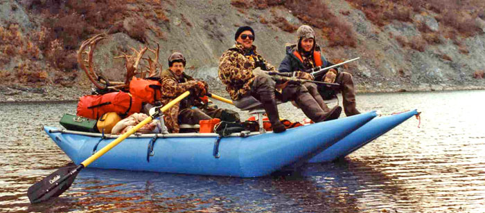 Paul Jobe, Neil McMahon and Brad Garness on a float hunting trip on Alaska's Noatak River in 1989.
