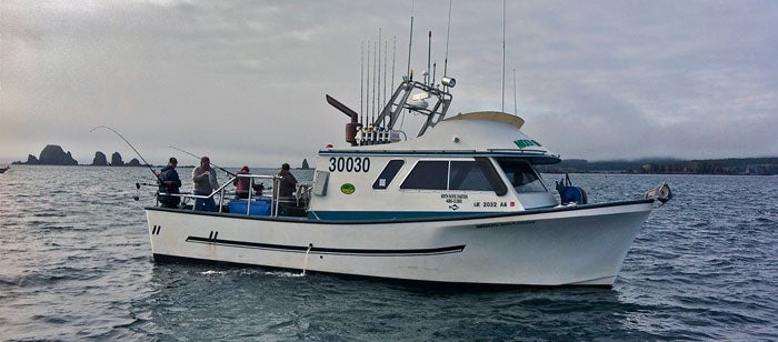 Anglers enjoying the saltwater king salmon and lingcod fishing on Kodiak Island, Alaska