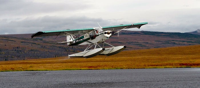 Flying out of a remote Alaska river on a float hunt for moose